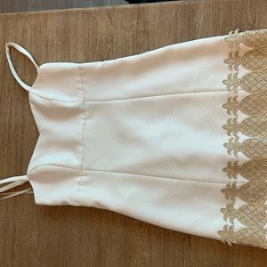 White Lilly Pulitzer dress with spaghetti straps and gold pineapple detailing